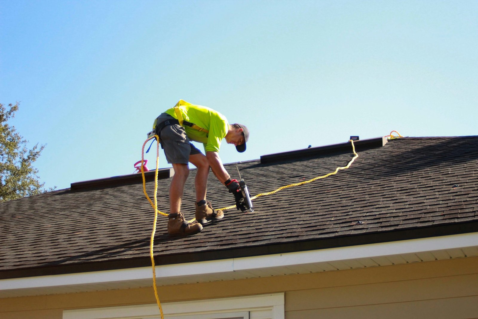 ajax-roof-repair Roofing contractor repairing leak on house in Ajax, On